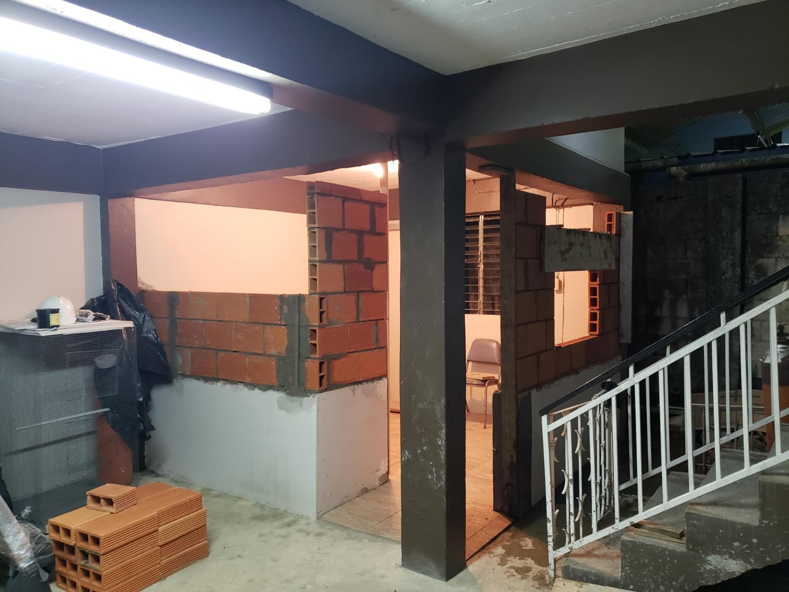 Property maintenance team restoring a building exterior and surrounding grounds